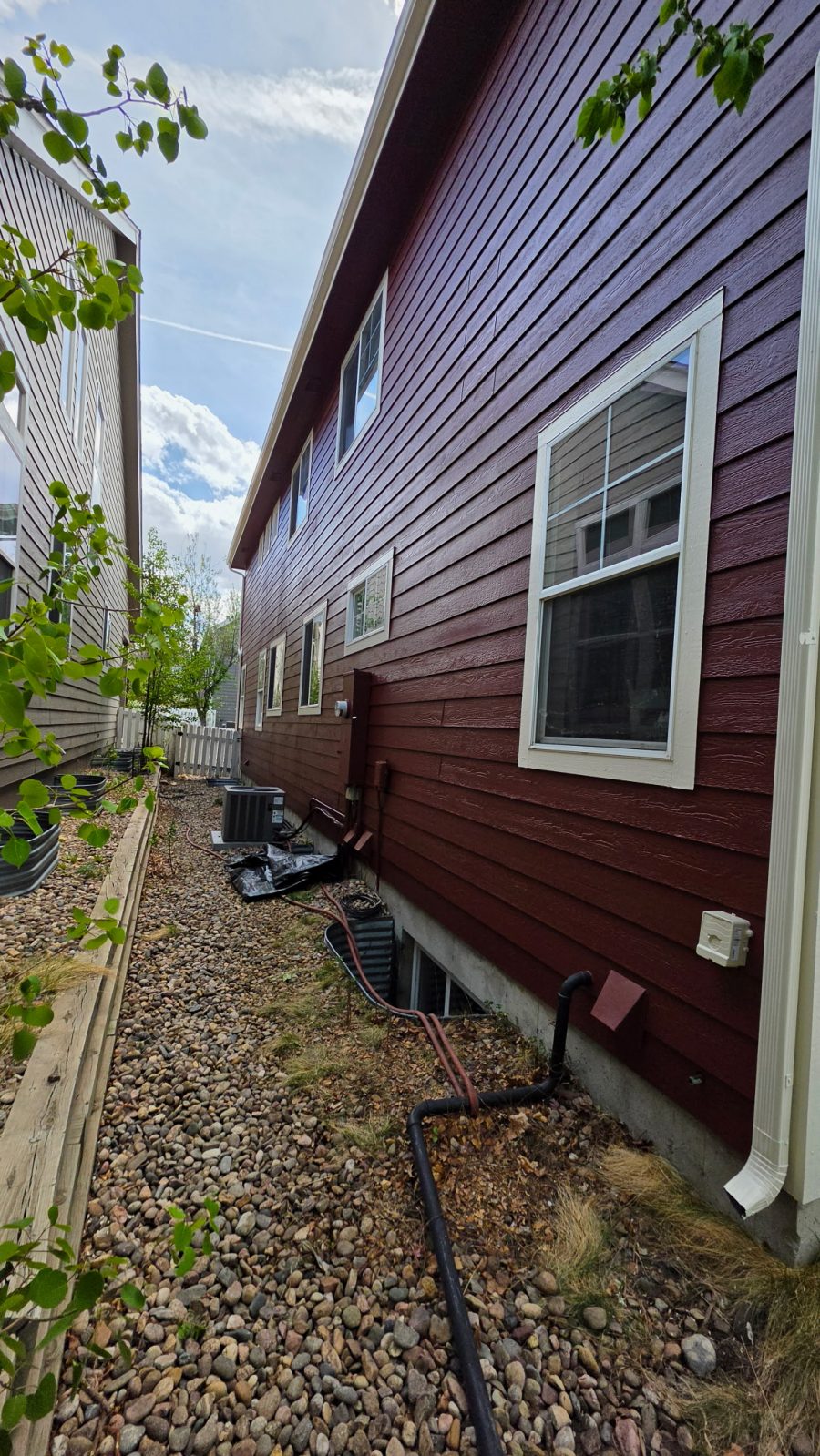 exterior siding of house painted dark red Preview Image 3