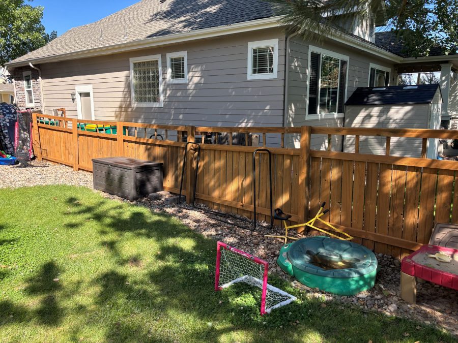 stained fence surrounding home and yard Preview Image 3
