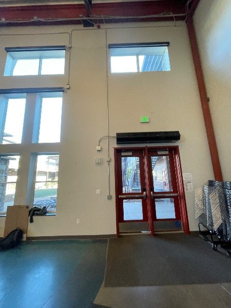 entryway to high-ceilinged school common room Preview Image 6