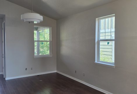room with off white walls and white trim
