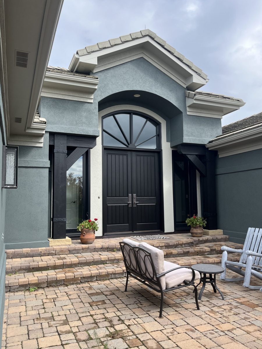 front entrance of blue painted stucco house