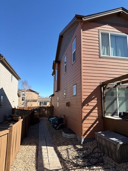 house exterior with rust colored siding before repant Preview Image 6