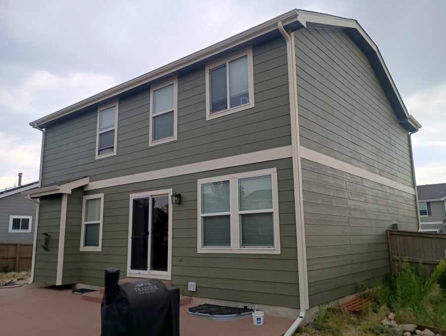 back of house with sage green painted siding Preview Image 2