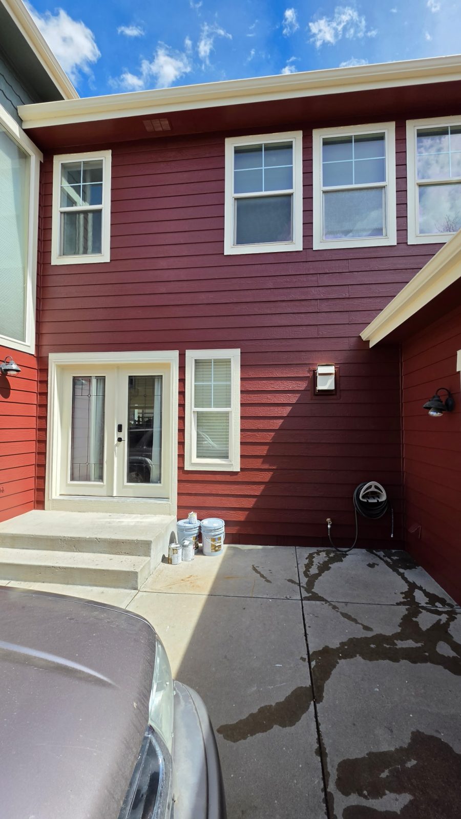 house exterior with dark red painted siding and white trim Preview Image 5