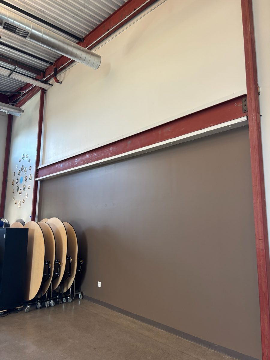 collapsed round tables stacked against brown painted wll Preview Image 3