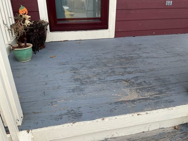 wooden porch with worrn grey paint and white trim Preview Image 8