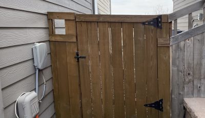 stained wooden fence gate