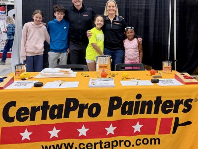 group of adults and children at CertaPro table