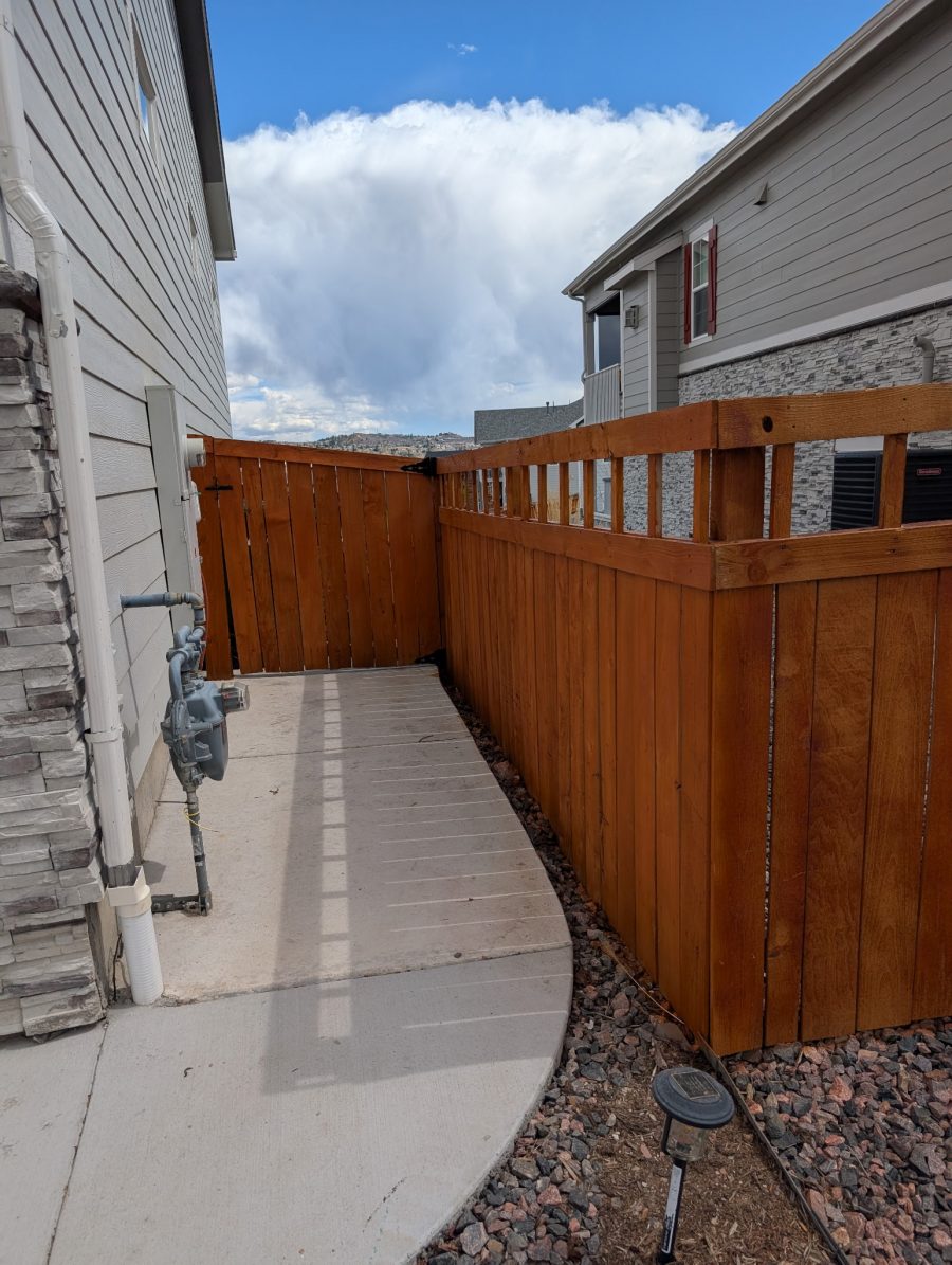 stained wooden fence gate between two houses Preview Image 6