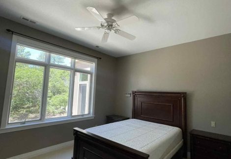 bedroom with bed and large windows