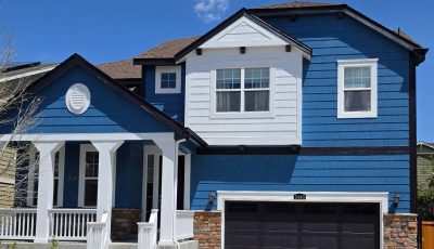 house exterior with blue siding and white accents