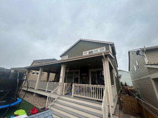 house exterior with faded green siding and beige porch Preview Image 2