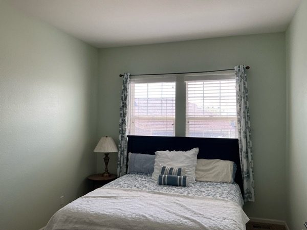 bedroom with pale green painted walls and bed Preview Image 3