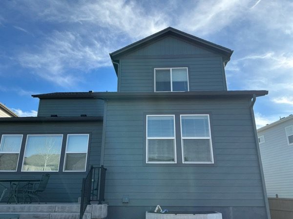 house exterior with dark teal siding before repaint Preview Image 4