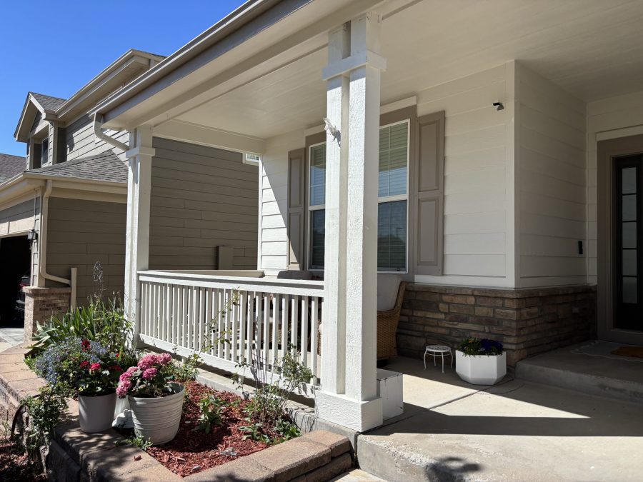 front porch of house with white siding and tan shutters and trim Preview Image 4
