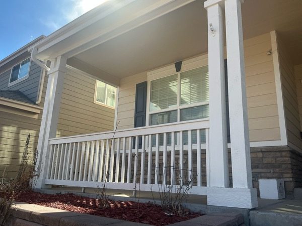 front porch of house with won paint on railing Preview Image 5