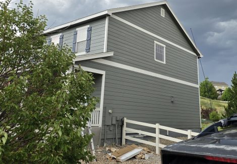 side of house with grey painted siding