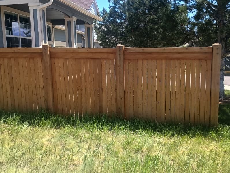 stained wooden fence surrounding yard Preview Image 3