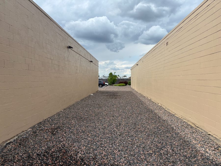 gravel area between two shopping center buildings Preview Image 6