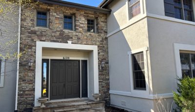 front door and steps of house with painted trim