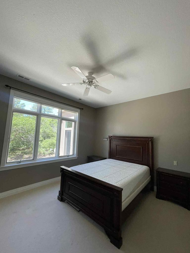 bedroom with bed and large windows Preview Image 5