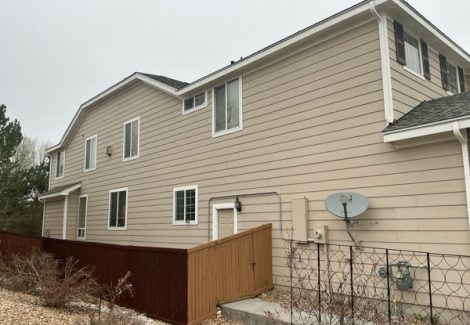 side view of house and driveway before painting project