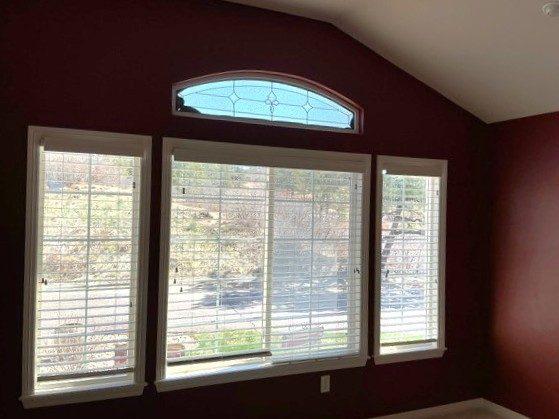 room with dark burgundy wall and large window Preview Image 4