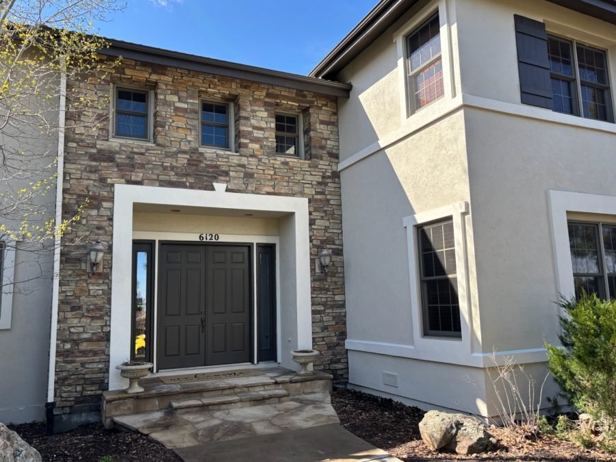 front door and steps of house with painted trim