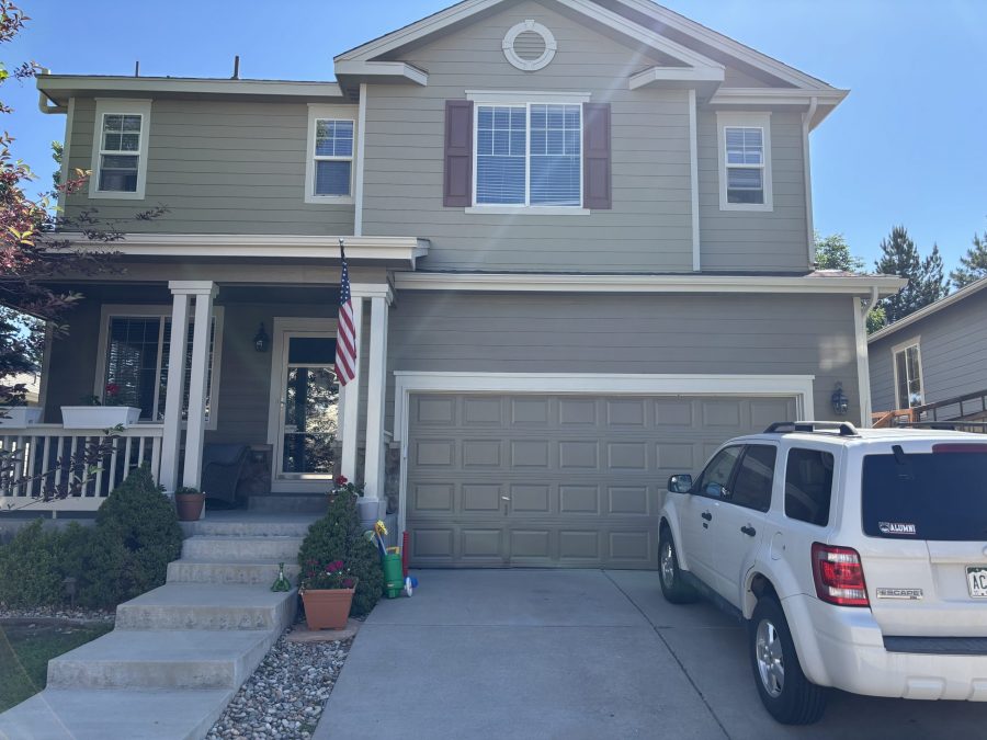 front view of driveway and garage door | two toned siding house
