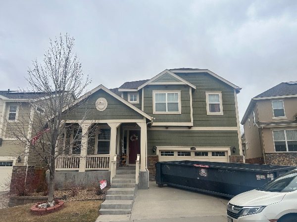 house exterior with faded green siding and beige accents Preview Image 3