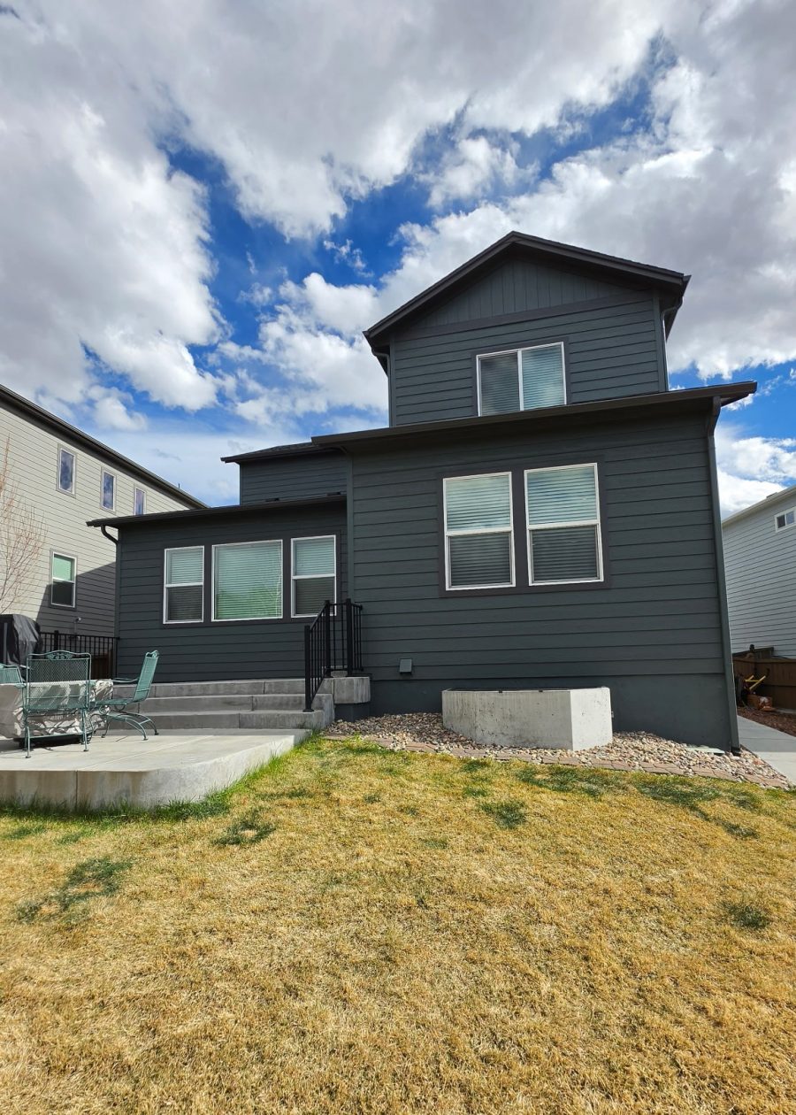 house exterior with dark teal siding after repaint Preview Image 3