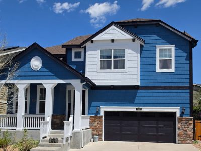 house exterior with blue siding and white accents