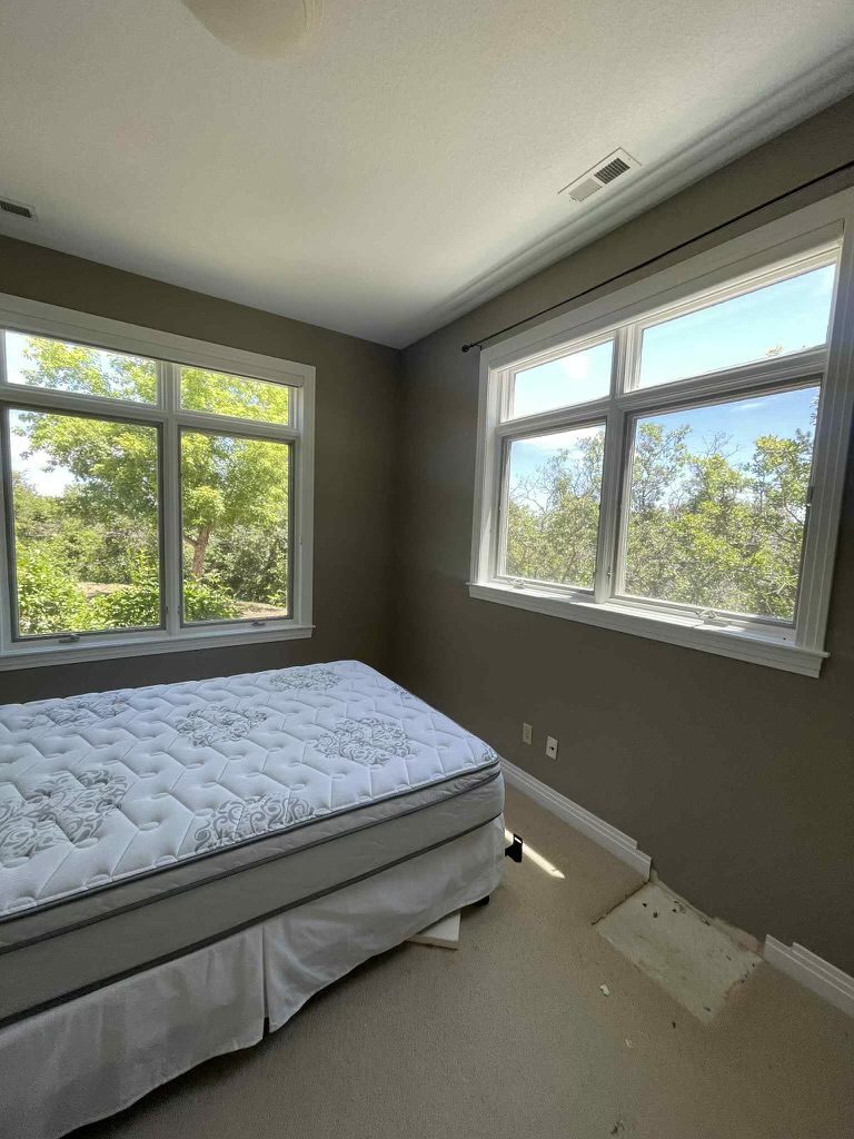 bedroom with bed and large windows Preview Image 4