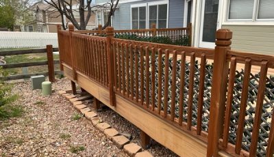 clear stained wooden deck attached to house