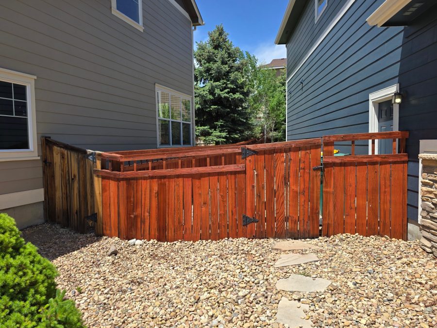 stained wooden fence outside of a home