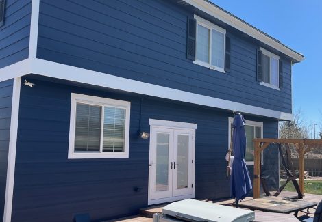 back of blue painted house