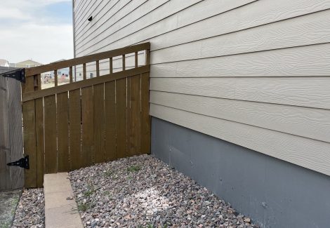 wooden fence against house