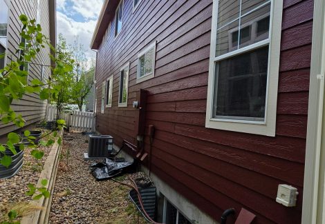 exterior siding of house painted dark red