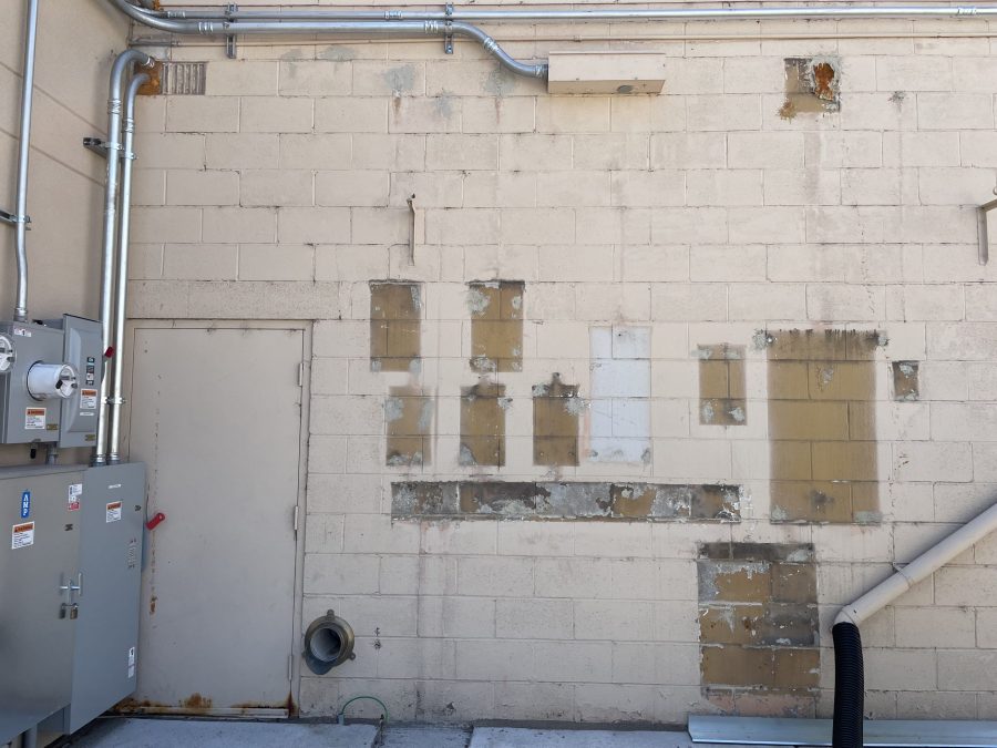 damaged paint on wall of shopping center Preview Image 8