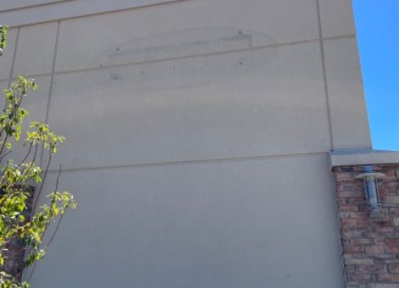 worn stucco on mall exterior