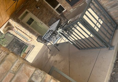 concrete patio with cafe table and chairs