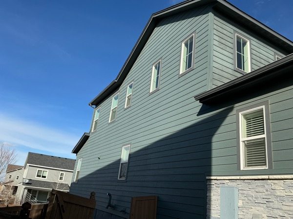 house exterior with dark teal siding before repaint Preview Image 5