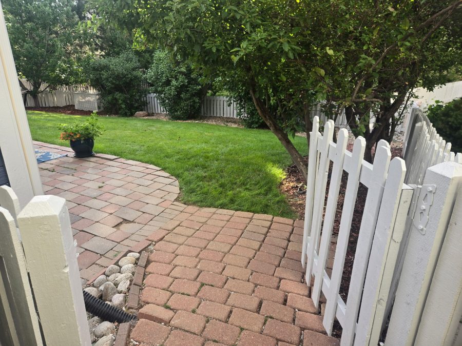 repainted white picket fence surrounding yard Preview Image 2