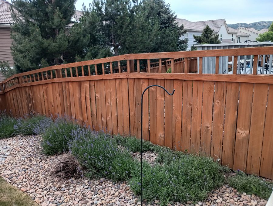 stained fence surrounding home and yard Preview Image 2