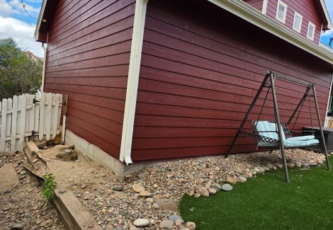 exterior siding of house painted dark red