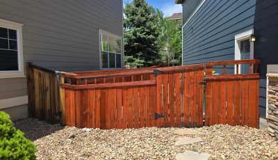 stained wooden fence outside of a home