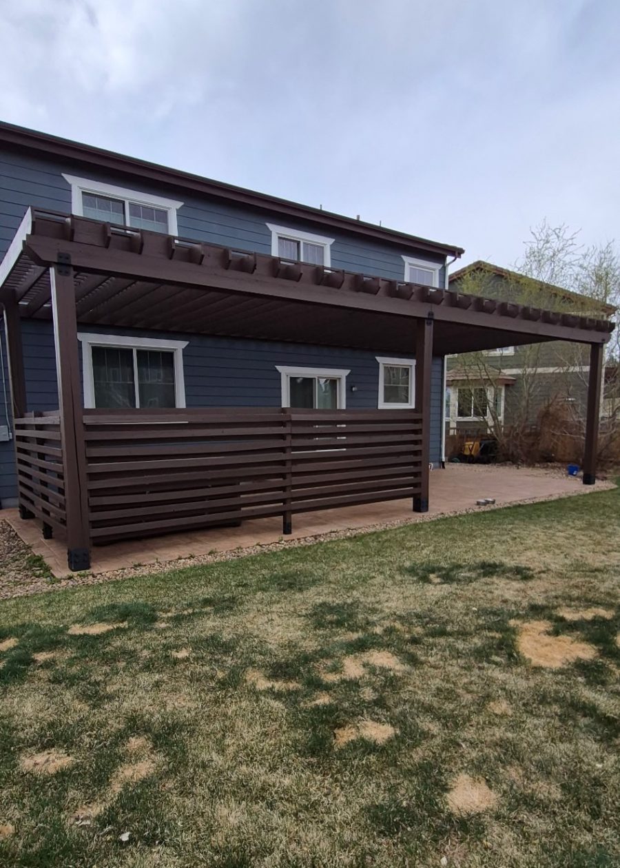 blue house with stained wooden pergola and fence Preview Image 1