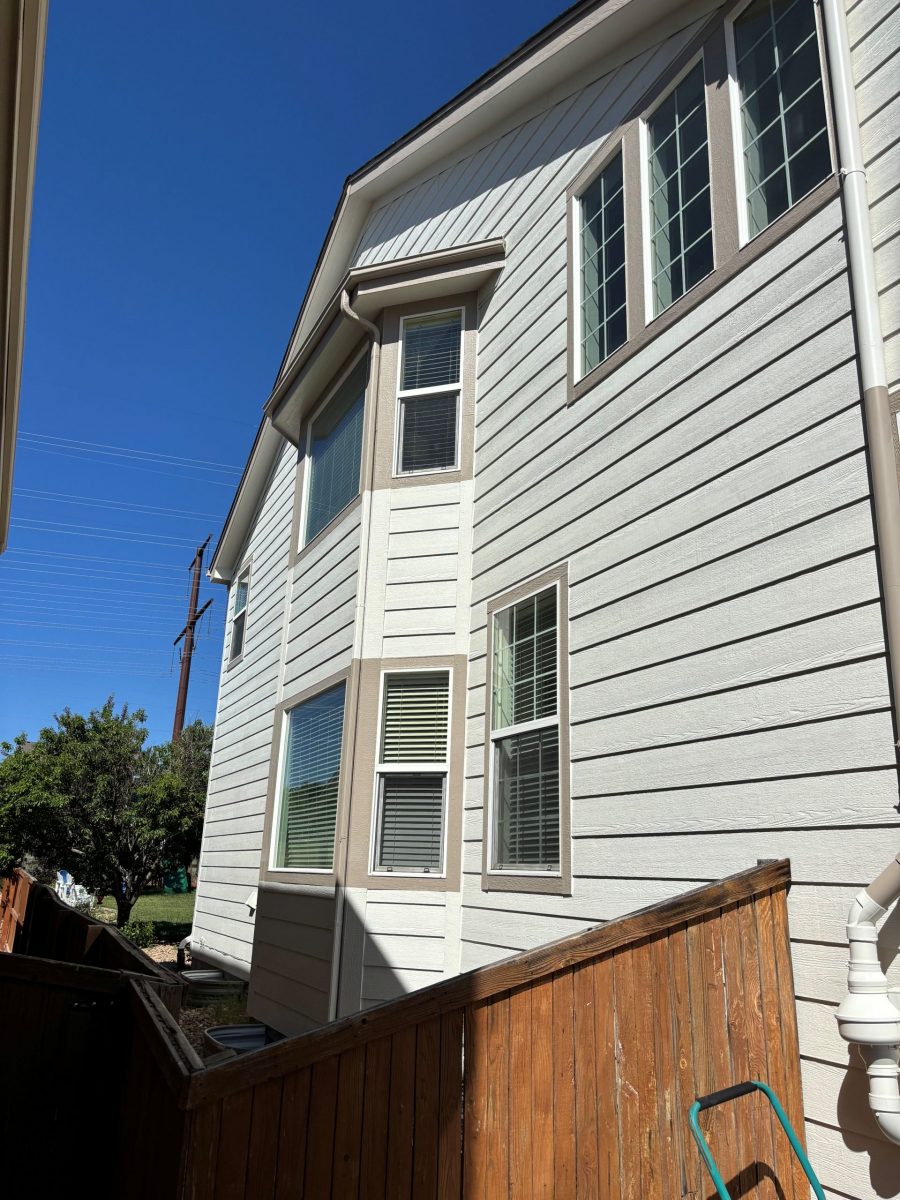 side exterior of house with white painted siding and brown trim Preview Image 3