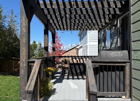 wooden pergola with worn stain
