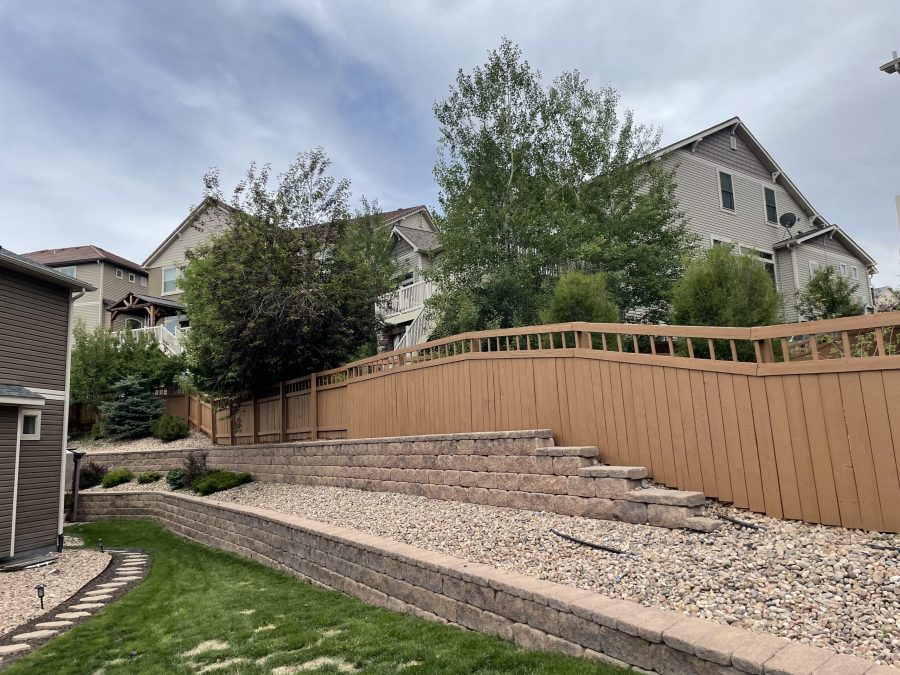 painted fence surrounding house